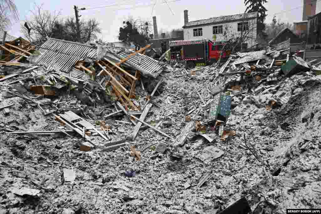 The early morning attack in Zmiyiv left behind a large crater and widespread destruction of civilian homes. 