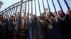 Members of the Mujahedin-e Khalk protest the police action on June 20 in Tirana.