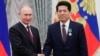 Russia's President Vladimir Putin (left) awards an Order of Friendship to China's Ambassador to Russia Li Hui at the Kremlin in May 2019.