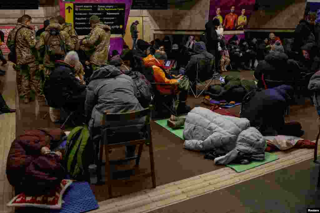People shelter inside a metro station during an air-raid alert in Kyiv on January 8. Ukraine said its air defenses had destroyed 18 out of 51 missiles, a much lower shoot-down rate than normal, which Kyiv attributed to the large number of ballistic missiles fired by Russia.