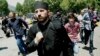 Orthodox clergy and Orthodox Christian activists clashed with gay-rights activists at a rally in Tbilisi marking International Day Against Homophobia on May 17.
