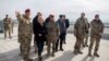 FILE: German Defense Minister Ursula von der Leyen (2-L) takes a tour of the Camp Marmal in Mazar-e Sharif in December 2015.