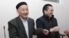 Kenzhebek Abishev (left) and Almat Zhumagulov appear in the court during their trial in Almaty in September 2018.