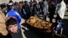 People attend the funeral ceremony of a victim who was killed in twin bombings that targeted the parliament building in Kabul last month.