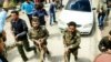 A photo allegedly showing a member of Iran's Islamic Revolutionary Guards Corps after being captured by opposition forces in Syria.