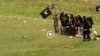 Grab from a video that shows militants loyal to the Islamic State (IS) blowing up bound and blindfolded Afghan prisoners with explosives. The victims were from Nangarhar province.IS issued the video in August 2015.