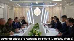 Belarusian Interior Minister Ivan Kubrakov (center left) meets Serbian Deputy Prime Minister Aleksandar Vulin (center right) in Minsk on October 30.