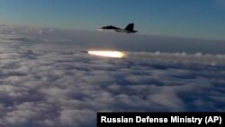 RUSSIA -- An Su-30 fighter jet of the Russian air force launches a missile during maneuvers in southern Russia, September 27, 2018