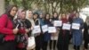 FILE: A journalists protest in northern Afghanistan.