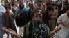 A man mourns the death of a relative who was killed in a suicide blast at the tomb of Sufi saint Syed Usman Marwandi, also known as the Lal Shahbaz Qalandar shrine, on February 16.