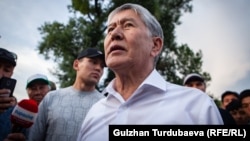 Ex-President Almazbek Atambaev speaks to supporters outside his home near Bishkek on June 27. 