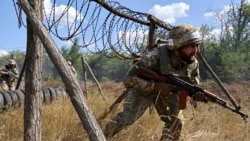 Soldiers from Ukraine's 65th Mechanized Brigade train in the Zaporizhzhia region on August 13.