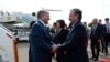 Uzbek President Shavkat Mirzieev (right) greets his Kyrgyz counterpart Almazbek Atambaev upon the latter's arrival in Tashkent on October 5. 