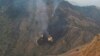 Flames rise from the wreckage of a Pakistan International Airlines (PIA) ATR 42 turboprop passenger plane after it crashed near Abbottabad on December 7.