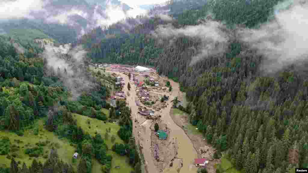 A drone image shows an area damaged by floodwaters in Romania's Suceava county.