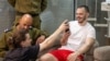 Andrei Kozlov speaks to relatives shortly after his rescue on June 7.